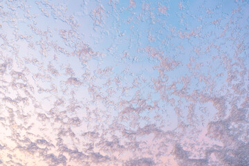 snow crystals at the window glass, sunset scenery