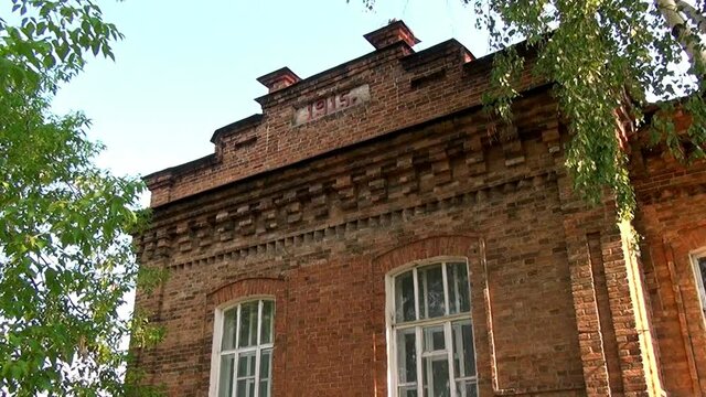 Alapaevsk, Russia - 17 July 2012: Windows of museum of Remembrance of Representatives of Russian Imperial House. Building, which contained relatives of Nicholas II before their execution.