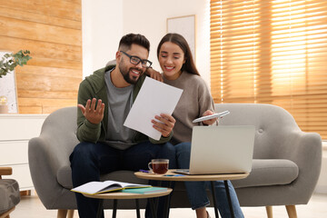Young couple discussing family budget at home - Powered by Adobe
