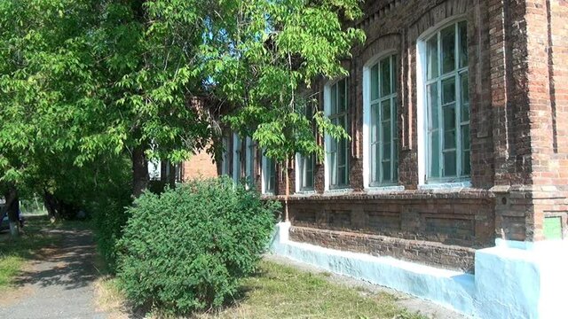 Alapaevsk, Russia - 17 July 2012: Windows of museum of Remembrance of Representatives of Russian Imperial House. Building, which contained relatives of Nicholas II before their execution.