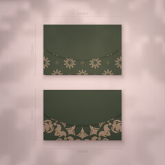 Presentable business card in green with Indian brown pattern for your brand.