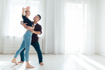 a man and a woman dance to the music of a pair dance of bachata