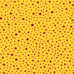 Bright yellow background and red maroon stars of different sizes. Festive pattern. Wrapping or gift paper design.