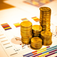 Gold coins stacks is representing riches and wealth management. Coin stack growing and find out the way to get a return on investment. Finance and money exchange investment as concept.