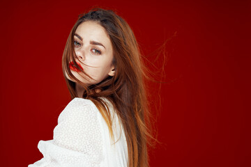 fashionable woman with red lips in red white dress isolated background