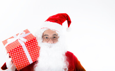 Santa claus with giftbox of presents on white background. Polite Santa claus with present on him shoulder for anybody. Christmas gift and happy New Year- Santa claus giving gift box.