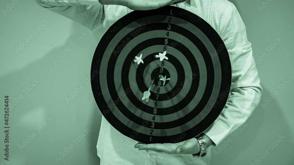Poster bullseye is a target of business. dart is an opportunity and dartboard is the target and goal. so bo