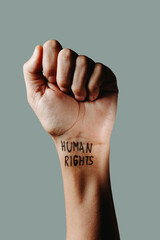 has the text human rights in his wrist