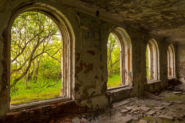 Large windows in an abandoned building.