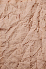 Top view on yellow wrinkled fabric. Background concept.
