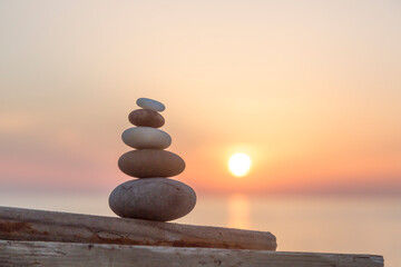 Stone Cairn At Seaside Sunset