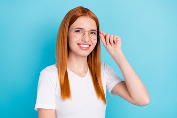 Fototapeta na wymiar Photo of young attractive girl happy positive smile condfident hand touch glasses isolated over blue color background