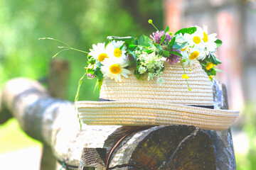 Spring background with straw hat and flowers