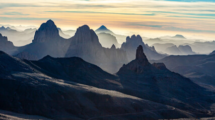 Ahaggar mountains in the sahara desert of algeria at sunrise - obrazy, fototapety, plakaty