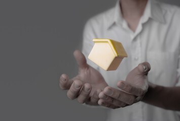 New home and house concept,businessman holding model house