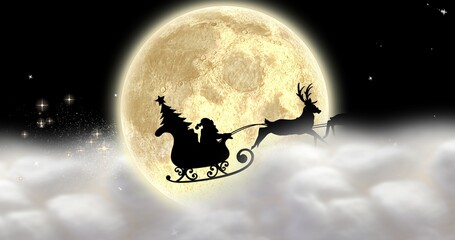 Fototapeta premium Composition of silhouette santa sleigh in full moon night with copy space