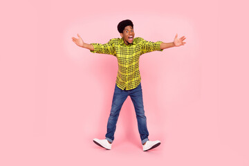 Full body photo of millennial impressed brunette guy want hug wear shirt jeans sneakers isolated on pink background