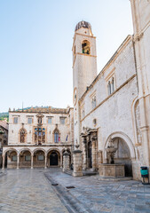 Fototapeta na wymiar Sponza palace at old city of Dubrovnik, Croatia. Tower with bells.
