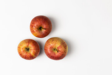 red ripe juicy apples on white