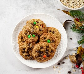 Homemade Oatmeal chocolate chip cookies on festive background, selective focus