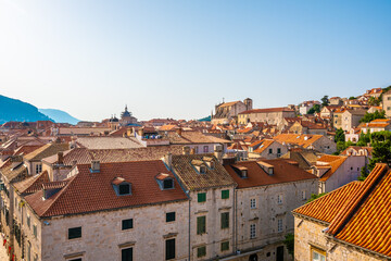 Fototapeta na wymiar Aerial panoramic view of old city of Dubrovnik. Church tower and look to ancient buildings. Sunny day.