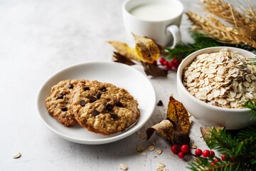 Homemade Oatmeal chocolate chip cookies on festive background, selective focus