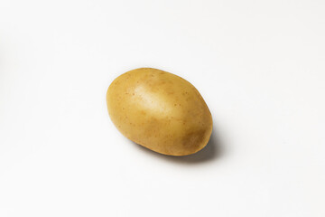 Fototapeta premium ripe potato on white background