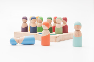 colored wooden men on a white background