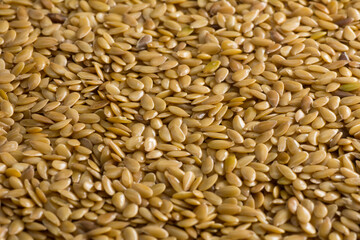 Golden Flax seeds background. Close-up
