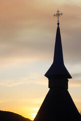 Obraz premium Silhouette of a church in the sunset sky