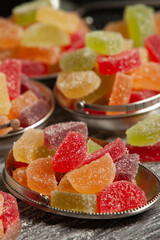 Dessert marmalade in the form of lemon and orange slices. The sweetness of jelly candy.