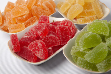 Dessert marmalade in the form of lemon and orange slices. The sweetness of jelly candy.