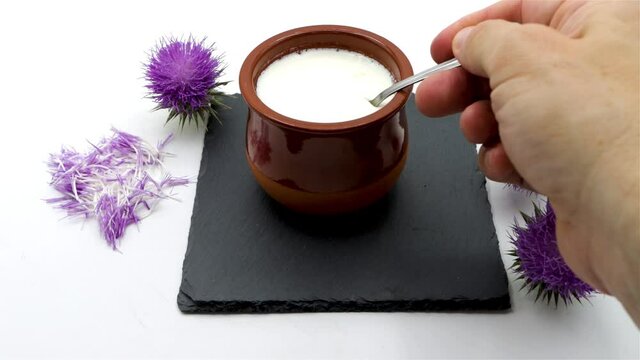 Showing a totally homemade curd made with natural thistle rennet on white background