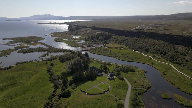 Cinematic aerial footage of Thingvellir national park, Iceland's parliament, the Thingvellir Church and the ruins of old stone shelters, hikes and lake in the golden circule