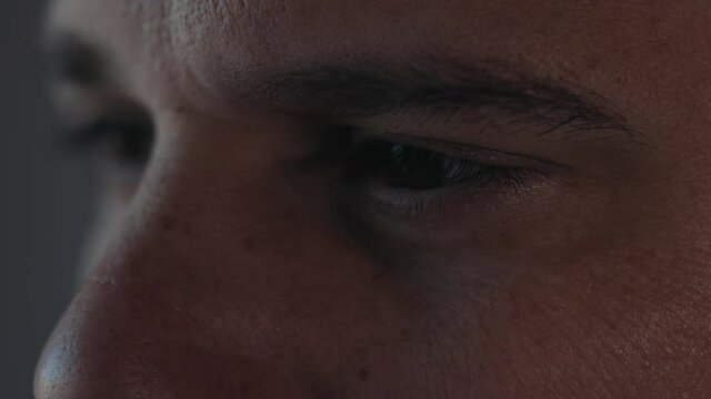 Extreme facial close up mature caucasian middle aged man 40s male eyes with wrinkles looking in distance out window thinking dreaming, enjoying good eyesight after successful laser correction operatio