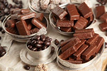 New Year's Eve table full of chocolates for children. Chocolate candy isolated 
