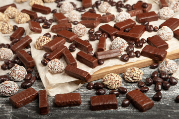 New Year's Eve table full of chocolates for children. Chocolate candy isolated 