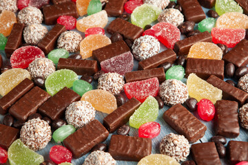New Year's Eve table full of chocolates for children. Chocolate candy isolated 