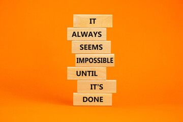 Possible or impossible symbol. Wooden blocks with words It always seems impossible until it is...