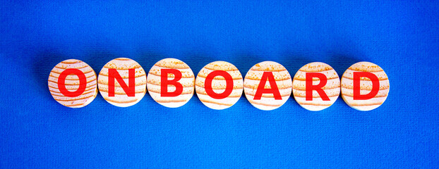Onboard and onboarding symbol. The concept word Onboard on wooden circles. Beautiful blue...