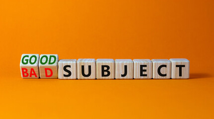 Good or bad subject symbol. Turned wooden cubes and changed the word bad subject to good subject. Beautiful orange table, orange background. Business, good or bad subject concept. Copy space.