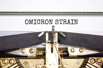 Covid-19 new omicron virus variant symbol. Concept words Omicron strain typed on retro typewriter....