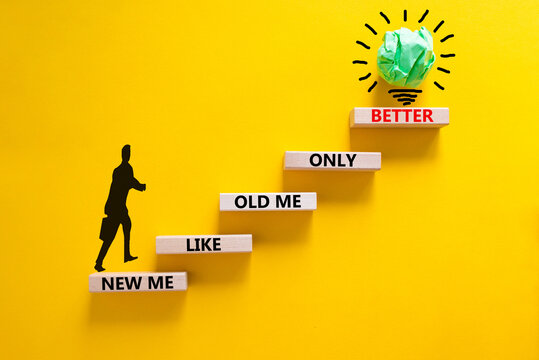 Better new me symbol. Wooden blocks with words 'new me like old me only better'. Beautiful yellow background, copy space. Businessman icon, light bulb. Business and better new me concept.