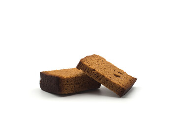 Closeup of sliced gingerbread cake on white background