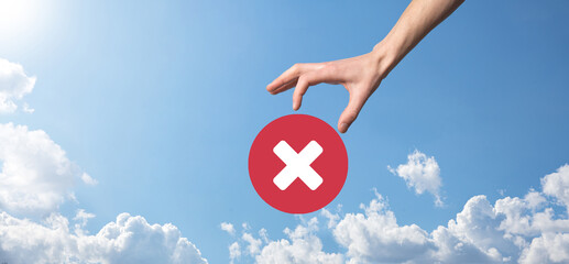 Hand holds icon,cancellation symbol,cancel icon.Cross mark flat red icon.round X mark.cancel...