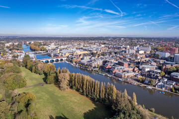 The drone aerial view of Kingston bridge across River Thames, and view of Kingston upon Thames,...