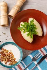 Lithuanian zeppelins decorate with parsley, restaurant. © Alex