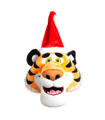 Head of a plush orange tiger in a red santa claus hat on a white background, isolate. Christmas and New Year 2022 concept, close-up