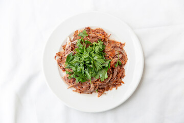 onion salad with parsley on white background