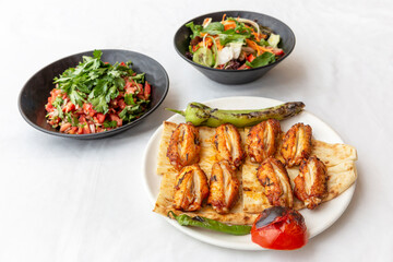 Chicken wings, chicken kebab with grilled vegetables